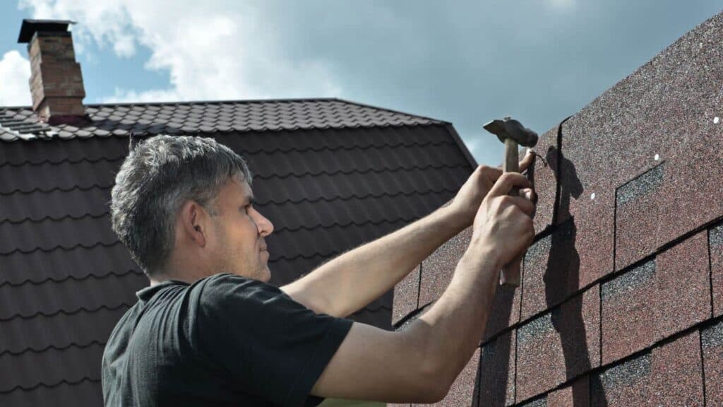 nailing a shingle near Ridgeline