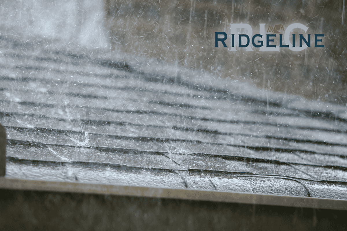 rain pouring down on a asphalt shingle roof