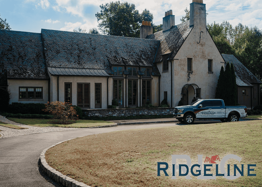 A Ridgeline project manager's truck in front of a client's home