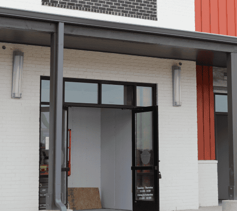 white brick storefront commercial construction example